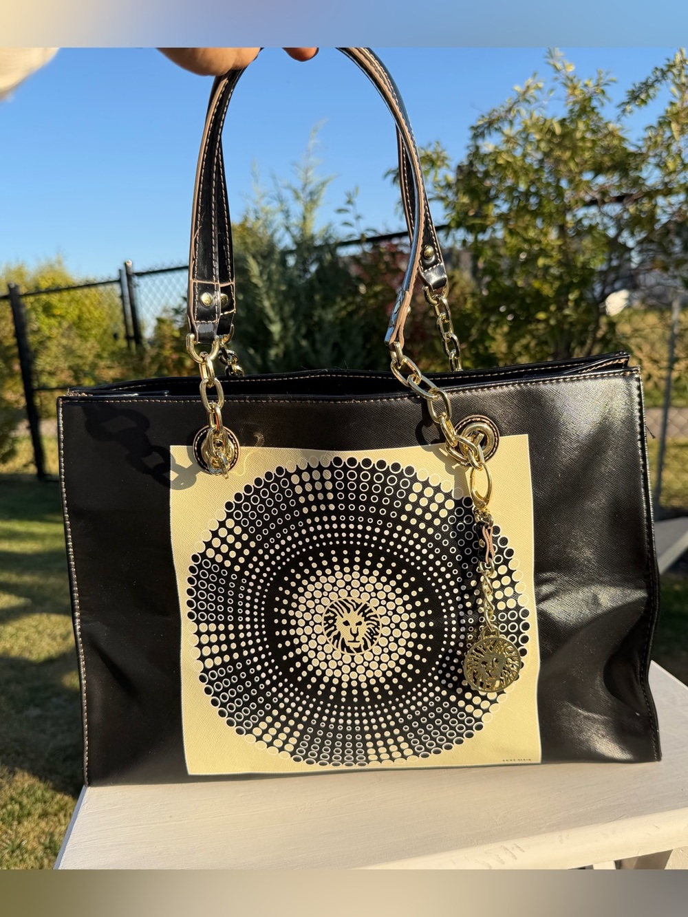 Anne Klein Black Tote with Cream Circular Motif and Gold Charm